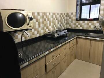 Kitchen in 1 BHK Apartment at Dosti West County, Balkum Pada – for Sale