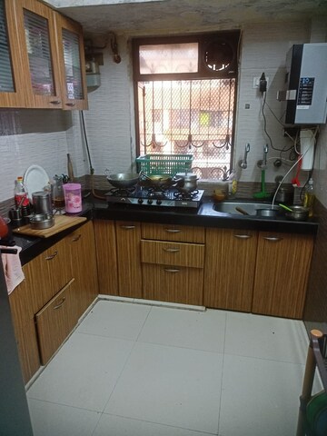 Kitchen in 2 BHK Apartment at Happy Home Complex, Mira Road – for Sale