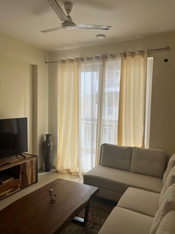 Living Room in 3 BHK Apartment at Emaar Palm Gardens, Sector 83 – for Sale