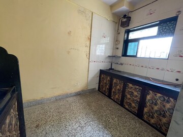 Kitchen in 1 BHK Apartment at Alaknanda CHS, Dahisar East – for Sale