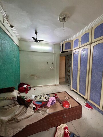 Master Bedroom in 2 BHK Apartment at Shree Suryodaya CHS, Dahisar East – for Sale