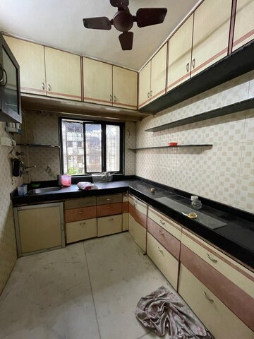 Kitchen in 2 BHK Apartment at Shree Suryodaya CHS, Dahisar East – for Sale