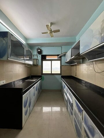 Kitchen in 3 BHK Apartment at Lodha Splendora, Ghodbunder Road – for Sale