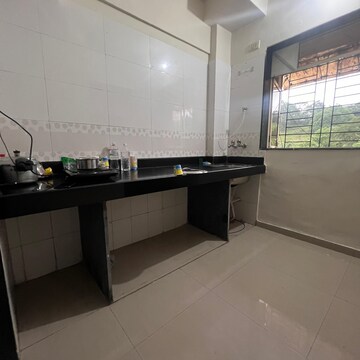 Kitchen in 1 BHK Apartment at Parsik Nagar – for Sale