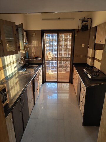 Kitchen in 2 BHK Apartment at Regency Estate, Dombivli East – for Sale