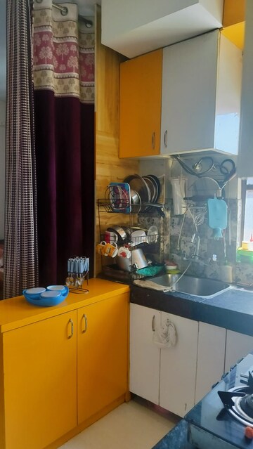 Kitchen in 1.5 BHK Apartment at Signature Global Synera, Sector 81 – for Sale