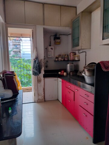 Kitchen in 1 BHK Apartment at Soham Parijat Gardens, Ghodbunder Road – for Sale