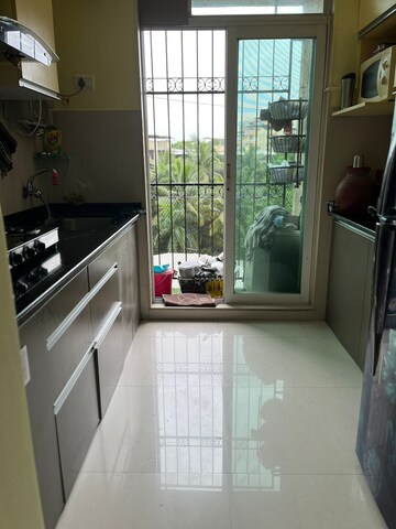 Kitchen in 1 BHK Apartment at Vijay Galaxy, Waghbil – for Sale
