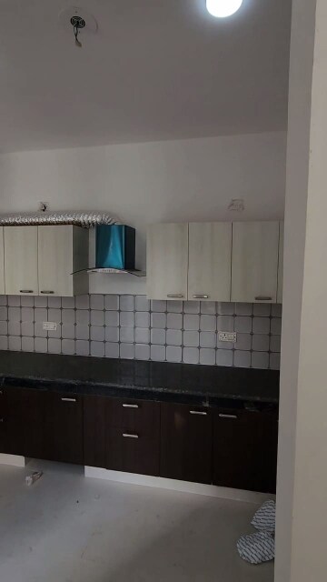 Kitchen in 2 BHK Apartment at Urban Axis Urban Woods, Sushant Golf City – for Sale