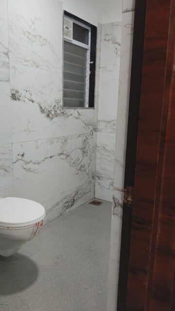 Bathroom in 4 BHK Apartment at Vile Parle East – for Sale