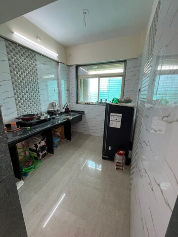 Kitchen in 1 BHK Apartment at Mohan Willows, Badlapur East – for Sale