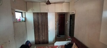 Bedroom in 2 BHK Apartment at Badrivishal Building, Dahisar East – for Sale