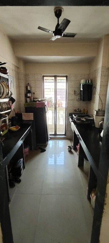 Kitchen in 2 BHK Apartment at Hiral Triveni CHS, Mira Road East – for Sale
