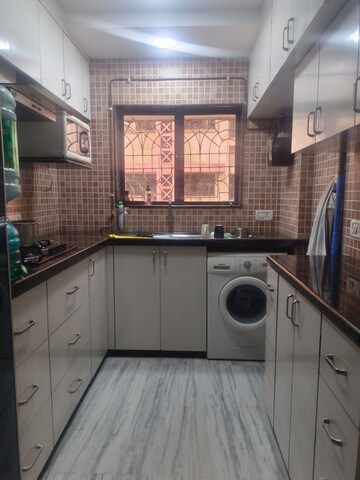 Kitchen in 2 BHK Apartment at Kumar Harshvardhan CHS, Andheri West – for Sale