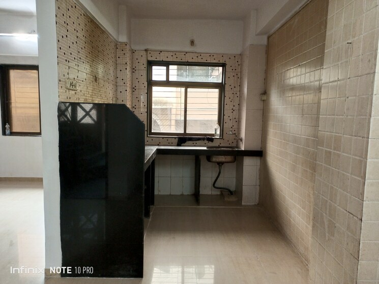 Kitchen, elite-niwas 2 Bedroom 1066 Sq.Ft. Apartment In Kopar Khairane Navi Mumbai 7395161
