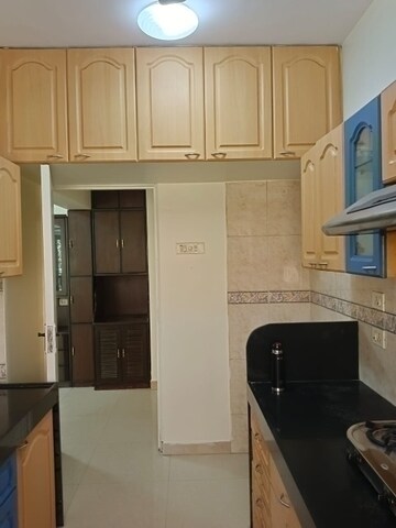 Kitchen in 3 BHK Apartment at Palm Springs, Malad West – for Sale