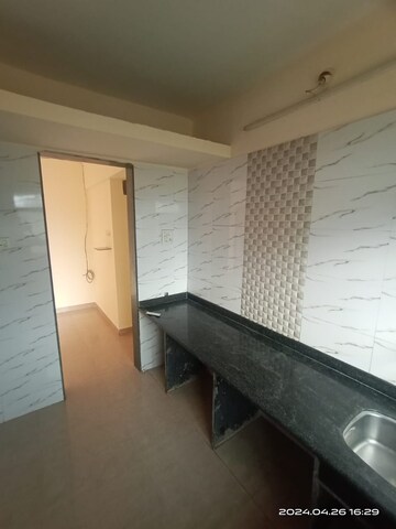 Kitchen in 2 BHK Apartment at Mohan Willows, Badlapur East – for Sale