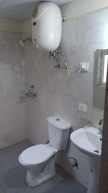 Bathroom in 2 BHK Apartment at Aims Golf City, Sector 75 – for Sale