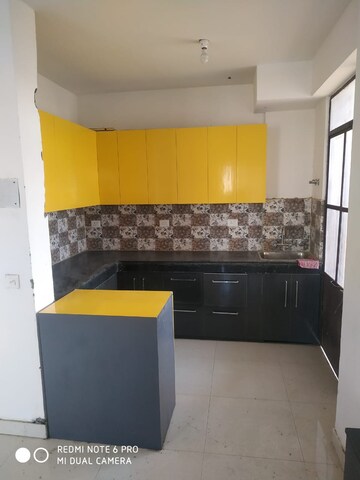 Kitchen in 1.5 BHK Apartment at Signature Global Synera, Sector 81 – for Sale