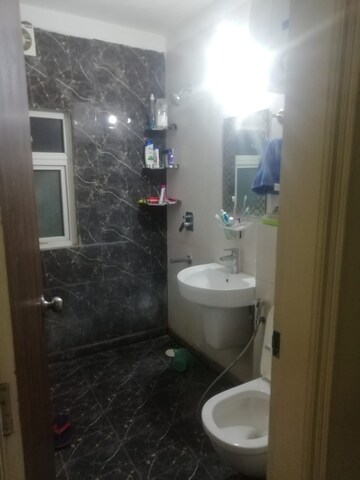 Bathroom in 2 BHK Apartment at Aims Golf City, Sector 75 – for Sale