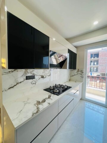 Kitchen in 3 BHK Builder Floor at Ansal API Esencia, Sector 67 – for Sale