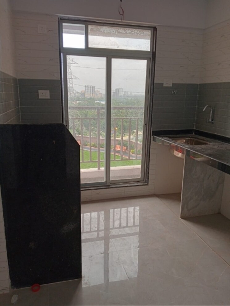 Kitchen, dosti-centerio-p180 1 Bedroom 515 Sq.Ft. Apartment In Shilphata Thane 7411945