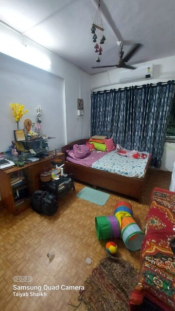Living Room in 2 BHK Apartment at Karachi Citizens CHS, Juhu – for Sale