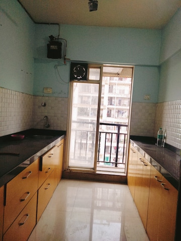 Kitchen in 1.5 BHK Apartment at Rosa Gardenia, Ghodbunder Road – for Sale