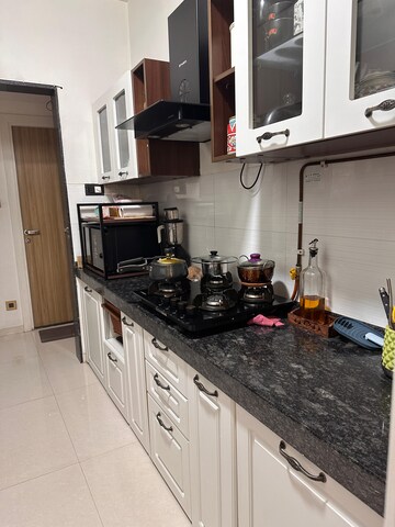 Kitchen in 3 BHK Apartment at Rustomjee Urbania Azziano, Majiwada – for Sale