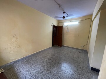 Master Bedroom in 1 BHK Apartment at Alaknanda CHS, Dahisar East – for Sale