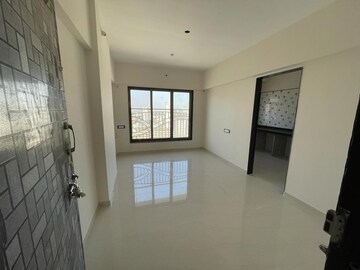 Living Room in 1 BHK Apartment at Harshal Devchhaya, Dahisar East – for Sale