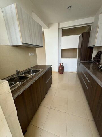Kitchen in 3 BHK Apartment at Sushma Elite Cross, Dhakoli Village – for Sale