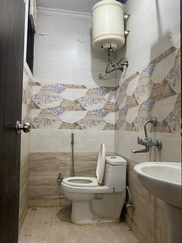 Bathroom in 1.5 BHK Builder Floor at Neb Sarai – for Sale