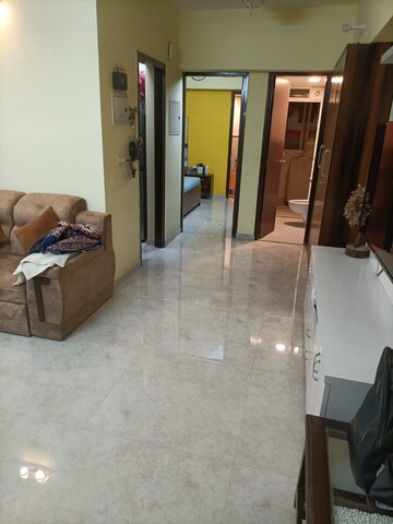 Living Room in 1 BHK Apartment at Lodha Amara, Kolshet Road – for Sale