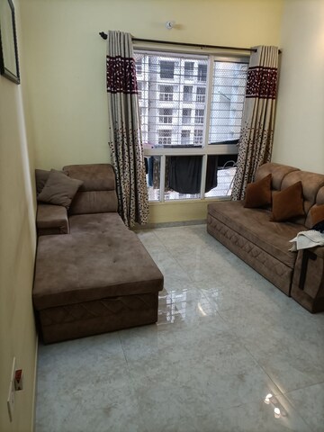 Living Room in 1 BHK Apartment at Lodha Amara, Kolshet Road – for Sale