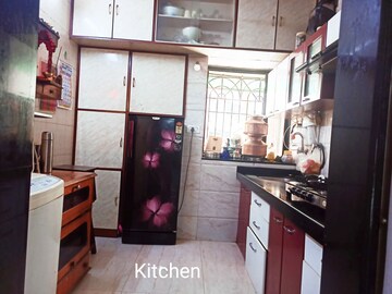 Kitchen in 2 BHK Apartment at Cirrus CHSL Cosmos Paradise, Vasant Vihar – for Sale