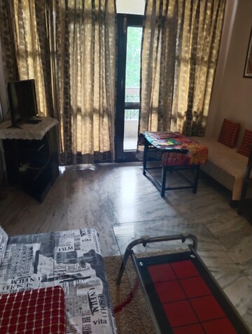Living Room in 1 BHK Apartment at Supertech Czar Suites, Omicron I Greater Noida – for Sale