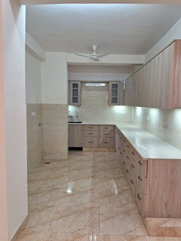 Kitchen in 4 BHK Apartment at Vasundhara Enclave – for Sale