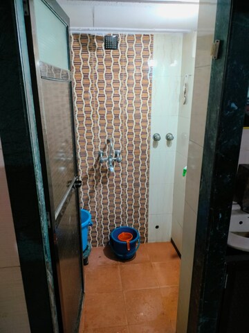 Bathroom in 1 BHK Apartment at Lovely Cozy CHSL, Dahisar East – for Sale
