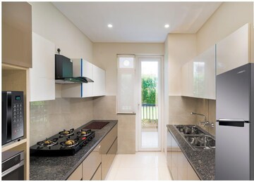Kitchen in 3 BHK Apartment at Motia Blue Ridge, Dhakoli Village – for Sale