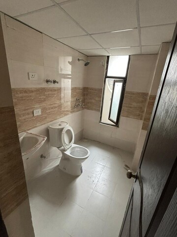 Bathroom in 3 BHK Apartment at Charms Castle, Raj Nagar Extension – for Sale