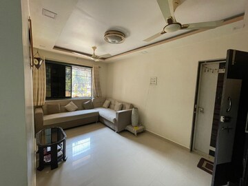 Living Room in 2 BHK Apartment at Mandakini CHS, Dahisar East – for Sale