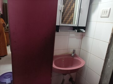 Bathroom in 1 BHK Apartment at Brahmand CHS, Brahmand – for Sale