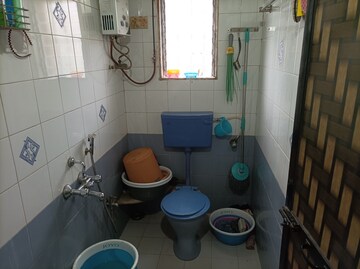 Bathroom in 1 BHK Apartment at Brahmand CHS, Brahmand – for Sale