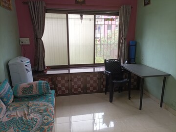 Living Room in 1 BHK Apartment at Brahmand CHS, Brahmand – for Sale