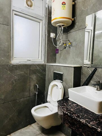 Bathroom in 1.5 BHK Builder Floor at Chattarpur – for Sale