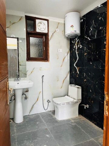 Bathroom in 1.5 BHK Builder Floor at Chattarpur – for Sale