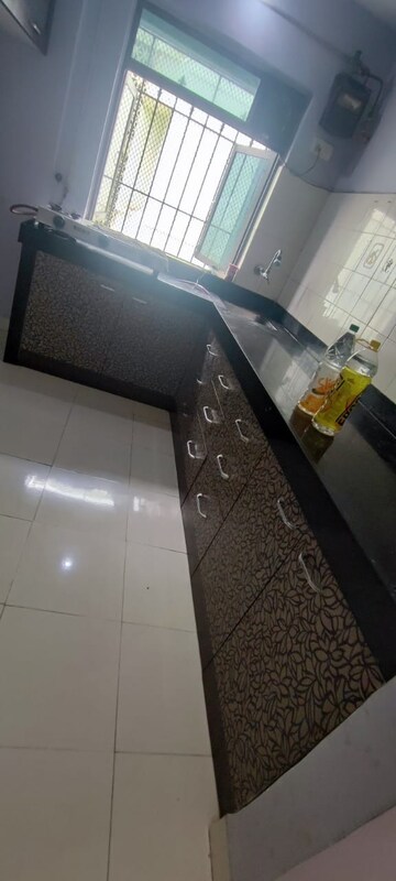 Kitchen in 1 BHK Apartment at New Brahmand Phase 7 CHS, Brahmand – for Sale