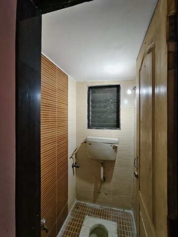 Bathroom in 2 BHK Apartment at Shankheshwar Nagar CHS, Dombivli East – for Sale