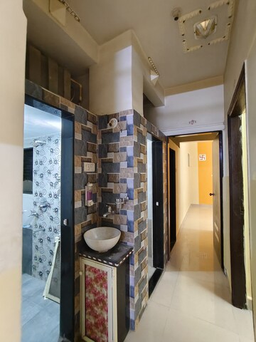 Living Room in 2 BHK Apartment at Shankheshwar Nagar CHS, Dombivli East – for Sale